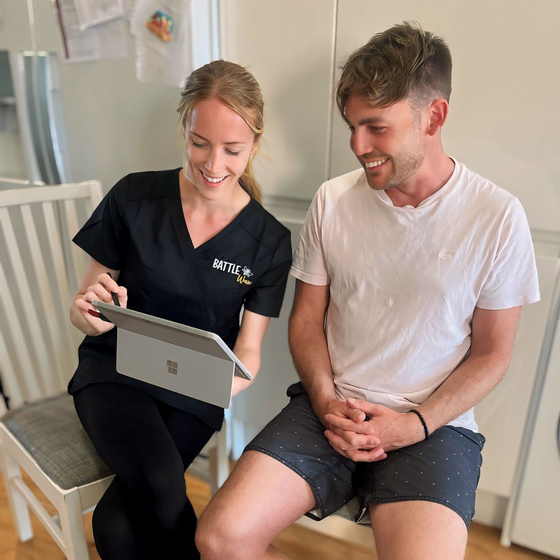 A client completing an earwax removal consultation.